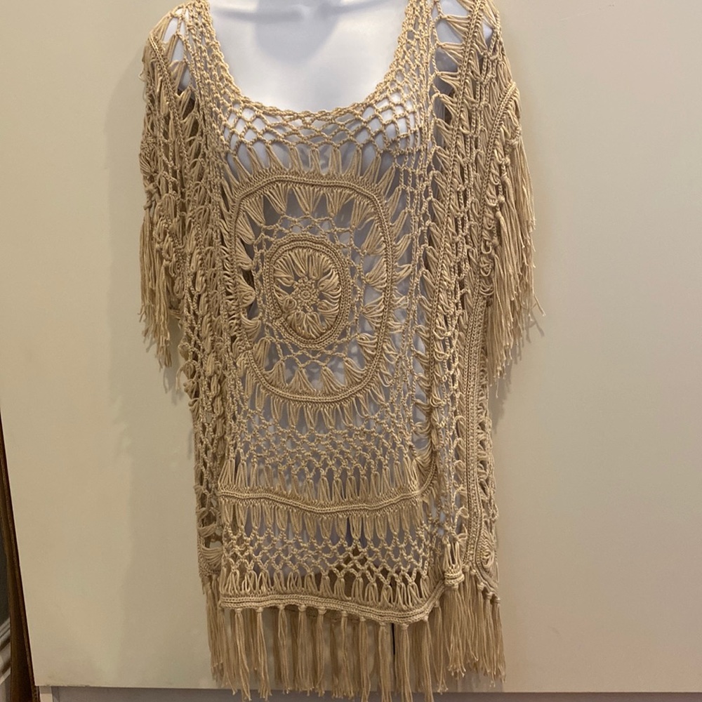 M Questions designer. Completely crochet design with a stretchy comfort feel